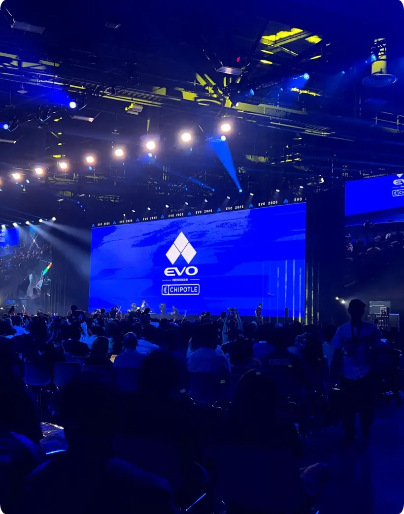 EVO Championship main stage with LED screens in front of a large audience